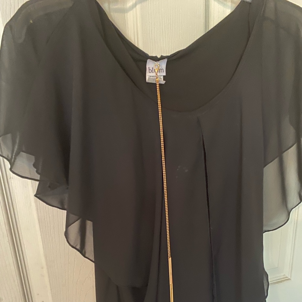 Black blouse with gold jewelry detail